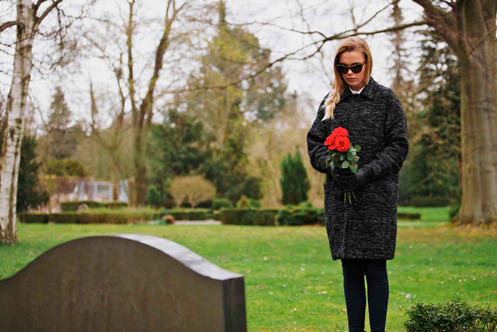 Woman Before Gravestone mourning death of a husband